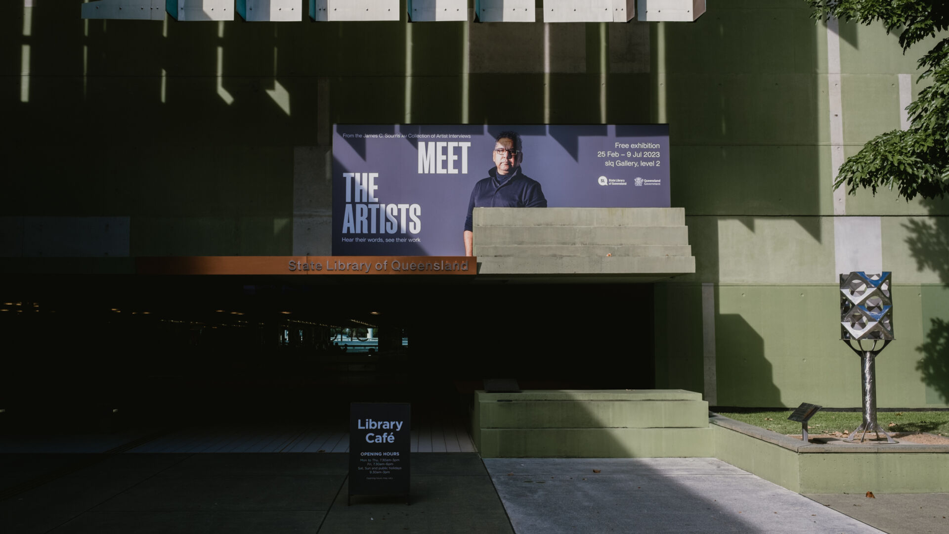 Outdoor banner designed to advertise the Meet The Artists Exhibition in Brisbane.
