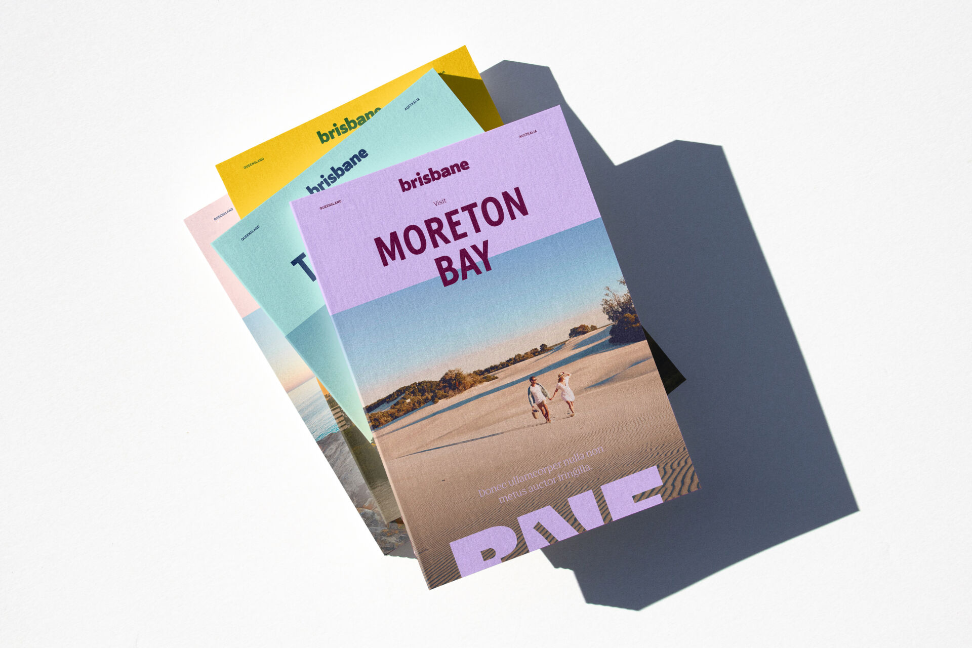 Brochure designs for the Brisbane brand identity, showcasing the extended colour palette